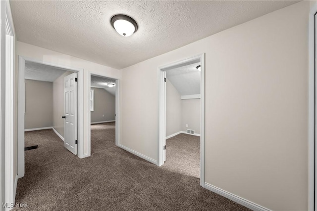 3695 S Hametown Rd, Norton, OH 44203 - hallway with dark colored carpet and a textured ceiling