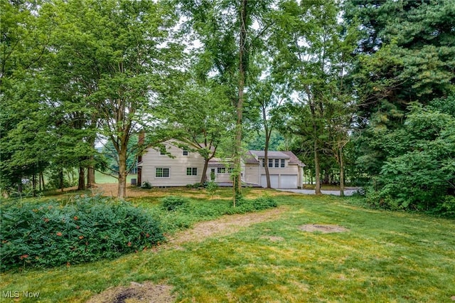 3695 S Hametown Rd, Norton, OH 44203 - view of green lawn with a garage