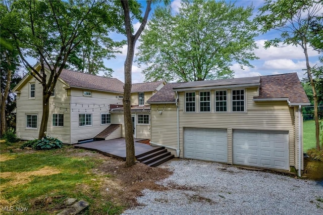 3695 S Hametown Rd, Norton, OH 44203 - back of house with a shingled roof and driveway