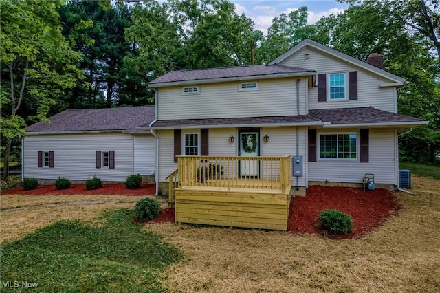 3695 S Hametown Rd, Norton, OH 44203 - view of front of property featuring a front lawn, a chimney, a deck, and a shingled roof