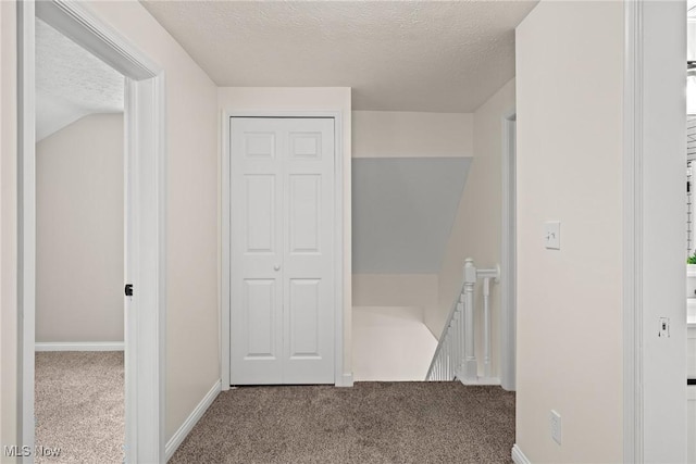 3695 S Hametown Rd, Norton, OH 44203 - hall with an upstairs landing, a textured ceiling, and carpet