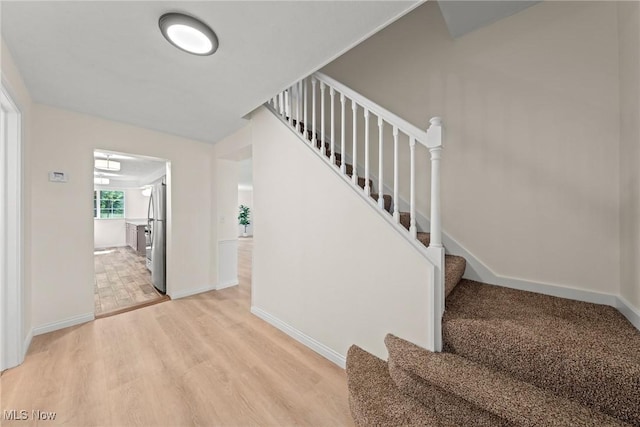 3695 S Hametown Rd, Norton, OH 44203 - staircase with wood finished floors and baseboards