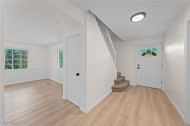 3695 S Hametown Rd, Norton, OH 44203 - entryway featuring light wood-style flooring and stairs