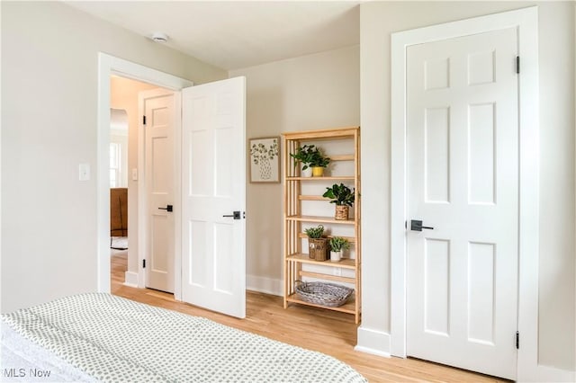 22100 Priday Ave, Euclid, OH 44123 - bedroom with light wood-style flooring and baseboards