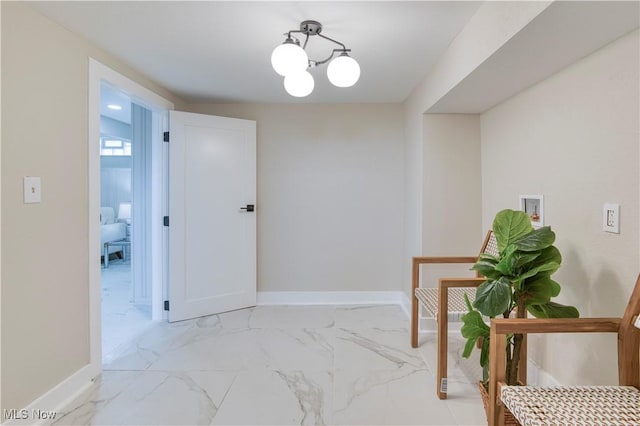 22100 Priday Ave, Euclid, OH 44123 - hall featuring light marble finish flooring and a chandelier