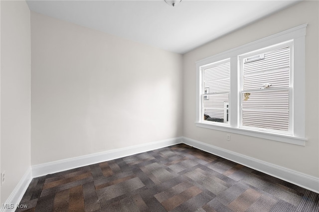 18830 Monterey Ave, Euclid, OH 44119 - unfurnished room featuring dark colored carpet and baseboards