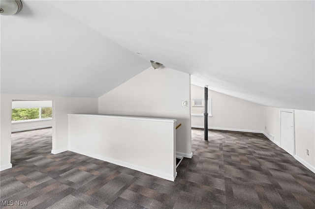 18830 Monterey Ave, Euclid, OH 44119 - additional living space with dark colored carpet and lofted ceiling