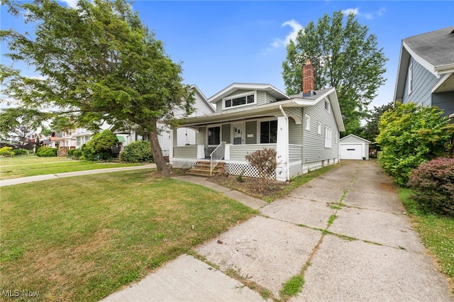 18830 Monterey Ave, Euclid, OH 44119 - bungalow-style home featuring a porch, an outdoor structure, a front lawn, driveway, and a chimney