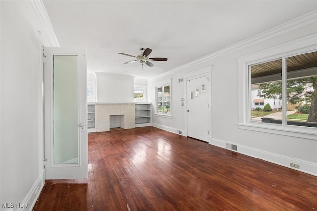 18830 Monterey Ave, Euclid, OH 44119 - unfurnished living room featuring ornamental molding, a ceiling fan, hardwood / wood-style flooring, and a brick fireplace