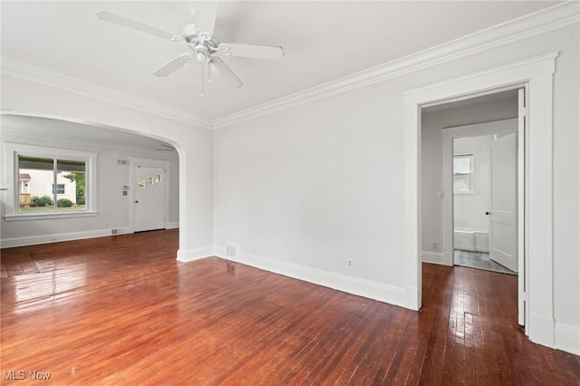 18830 Monterey Ave, Euclid, OH 44119 - empty room featuring hardwood / wood-style flooring, arched walkways, ceiling fan, and crown molding