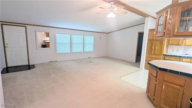 226 Troy Oaks Dr, Hiram, OH 44234 - unfurnished living room featuring light carpet, a ceiling fan, and crown molding