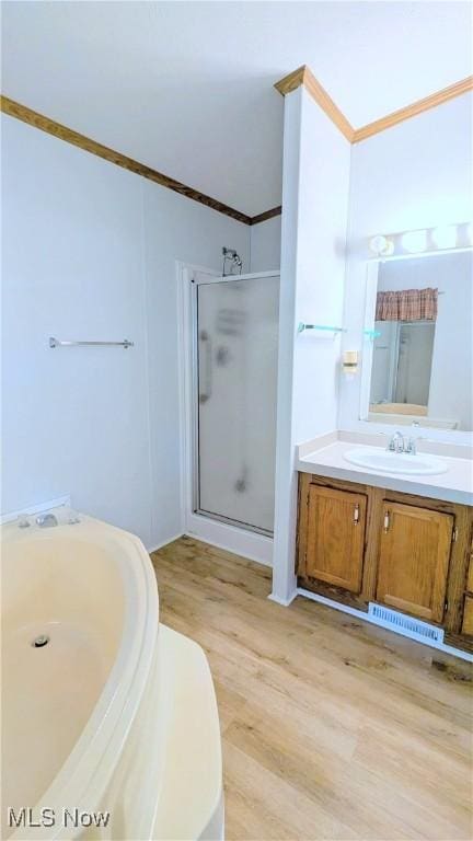 226 Troy Oaks Dr, Hiram, OH 44234 - full bath featuring crown molding, vanity, a stall shower, and wood finished floors