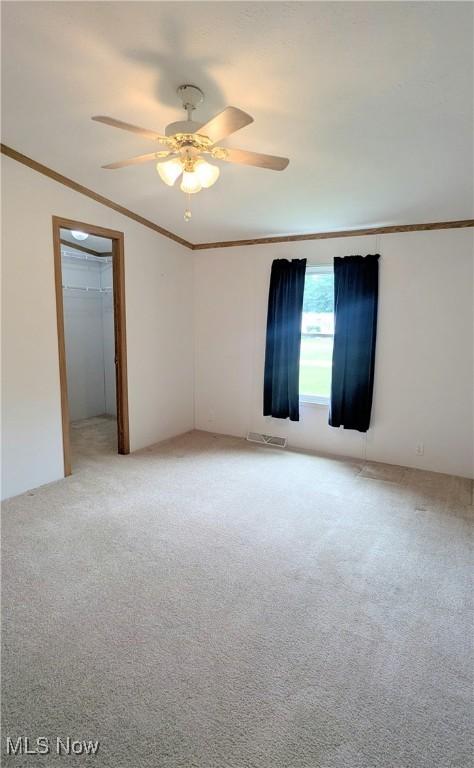 226 Troy Oaks Dr, Hiram, OH 44234 - unfurnished room featuring light carpet, ornamental molding, and ceiling fan