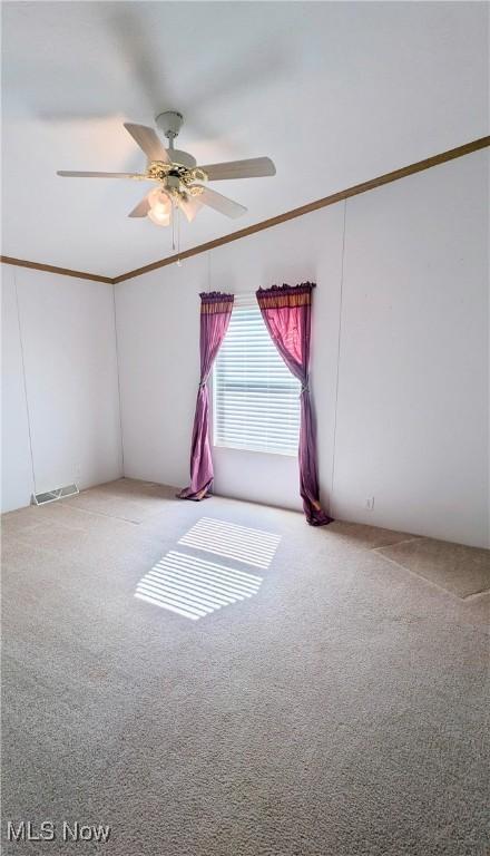 226 Troy Oaks Dr, Hiram, OH 44234 - carpeted spare room with a ceiling fan and crown molding