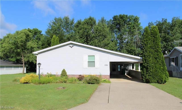226 Troy Oaks Dr, Hiram, OH 44234 - view of front facade featuring concrete driveway, a front yard, and an attached carport
