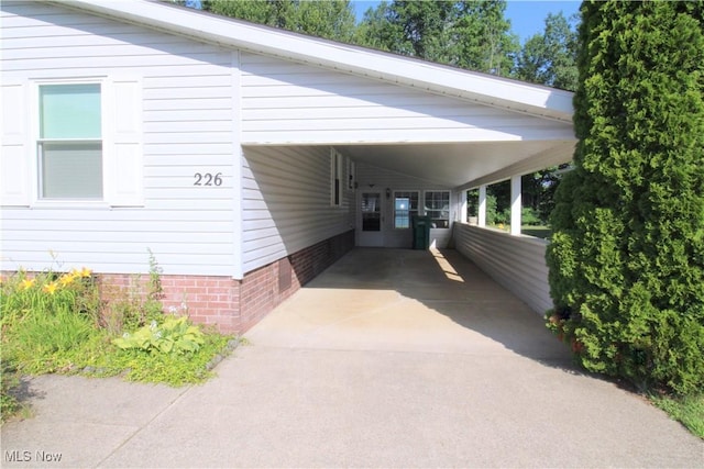 226 Troy Oaks Dr, Hiram, OH 44234 - view of vehicle parking featuring a carport and driveway