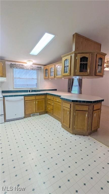 226 Troy Oaks Dr, Hiram, OH 44234 - kitchen featuring dishwasher, light floors, glass insert cabinets, and brown cabinets