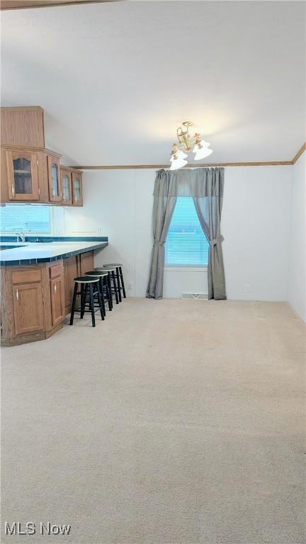 226 Troy Oaks Dr, Hiram, OH 44234 - dining room with light carpet and crown molding