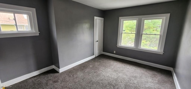 3624 E 154th St, Cleveland, OH 44120 - empty room with dark carpet and baseboards