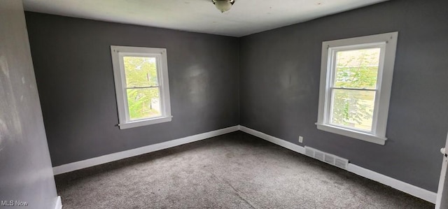 3624 E 154th St, Cleveland, OH 44120 - carpeted empty room featuring plenty of natural light