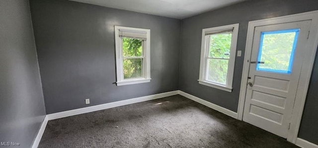 3624 E 154th St, Cleveland, OH 44120 - entryway featuring dark colored carpet and baseboards