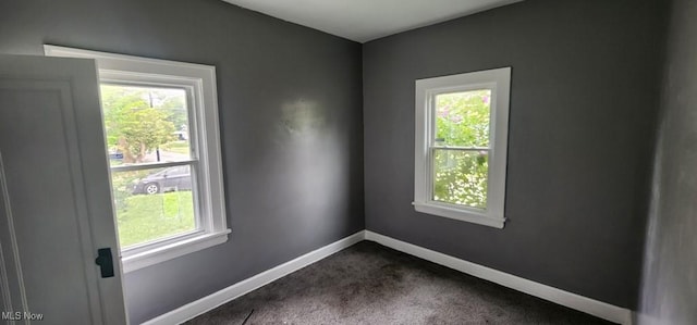 3624 E 154th St, Cleveland, OH 44120 - spare room with healthy amount of natural light and dark carpet