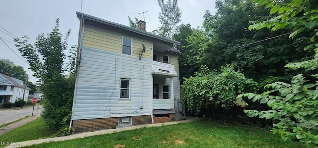 3624 E 154th St, Cleveland, OH 44120 - rear view of property with a chimney