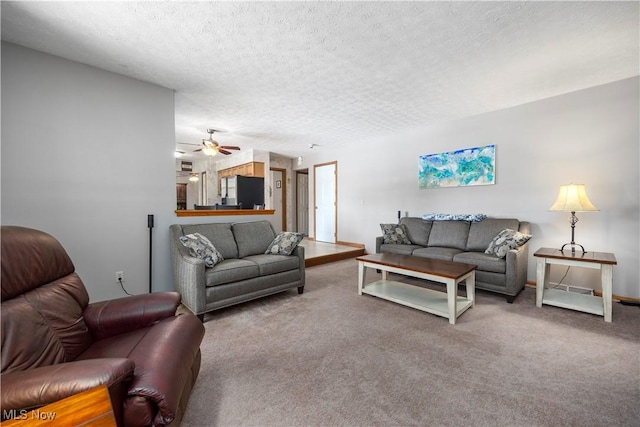 23730 Sawmill Bnd, Olmsted Falls, OH 44138 - living area featuring carpet flooring, a textured ceiling, and a ceiling fan