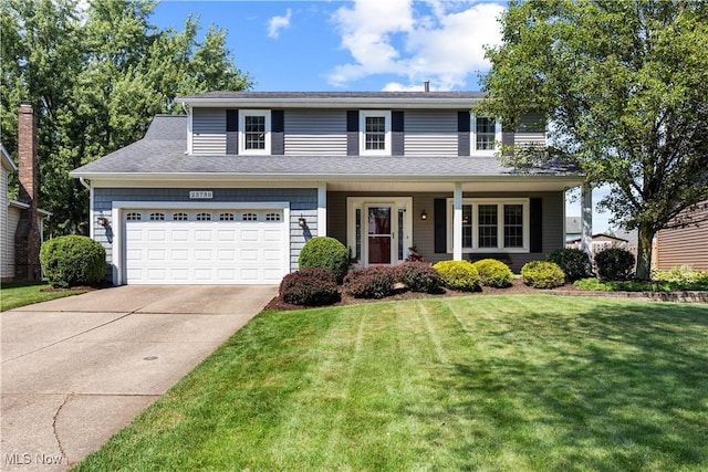 23730 Sawmill Bnd, Olmsted Falls, OH 44138 - traditional-style home with driveway, a front lawn, and a garage