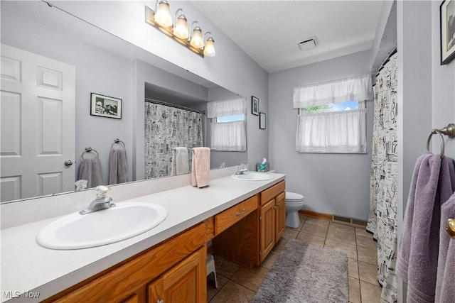 23730 Sawmill Bnd, Olmsted Falls, OH 44138 - full bath with double vanity, tile patterned flooring, and curtained shower