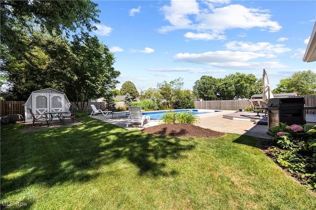 23730 Sawmill Bnd, Olmsted Falls, OH 44138 - fenced backyard with a storage unit and a patio area