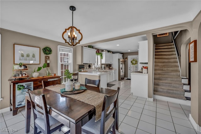 9013 Elsmere Dr, Parma, OH 44130 - dining space with a chandelier, stairs, light tile patterned floors, and recessed lighting
