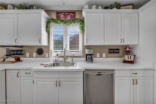 9013 Elsmere Dr, Parma, OH 44130 - kitchen with dishwasher, white cabinets, and light countertops