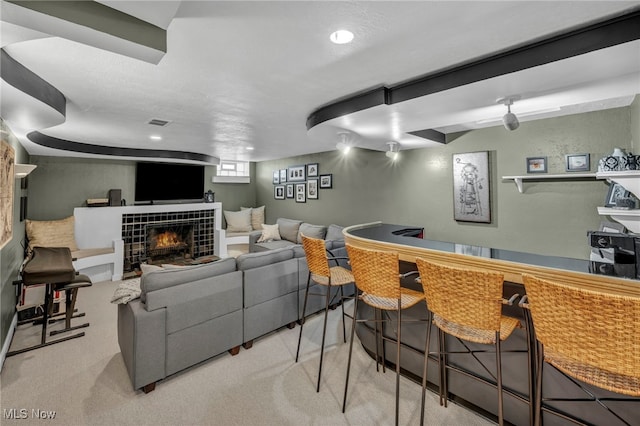 9013 Elsmere Dr, Parma, OH 44130 - living room with a tiled fireplace, a bar, and recessed lighting