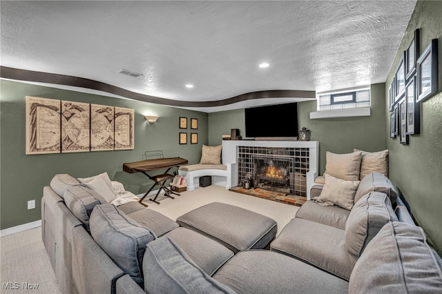 9013 Elsmere Dr, Parma, OH 44130 - living area featuring carpet, a fireplace, recessed lighting, and a textured ceiling