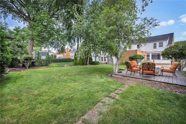 9013 Elsmere Dr, Parma, OH 44130 - fenced backyard with a wooden deck and outdoor lounge area