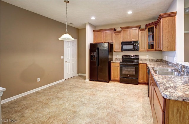 9111 Devonshire Dr, Olmsted Falls, OH 44138 - kitchen with black appliances, brown cabinetry, glass insert cabinets, and recessed lighting