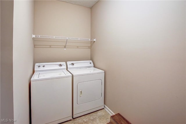 9111 Devonshire Dr, Olmsted Falls, OH 44138 - laundry area featuring independent washer and dryer and baseboards