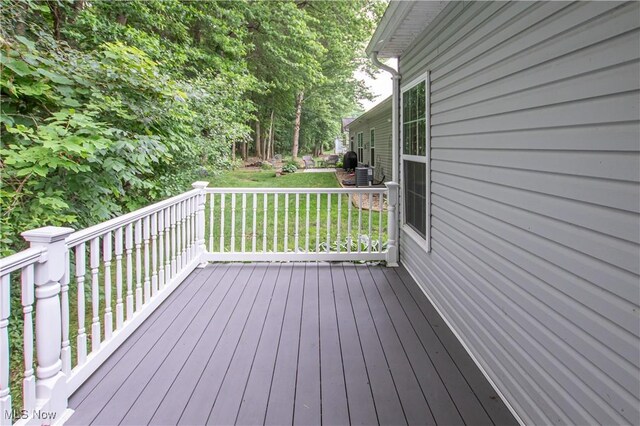 9111 Devonshire Dr, Olmsted Falls, OH 44138 - wooden deck featuring a lawn