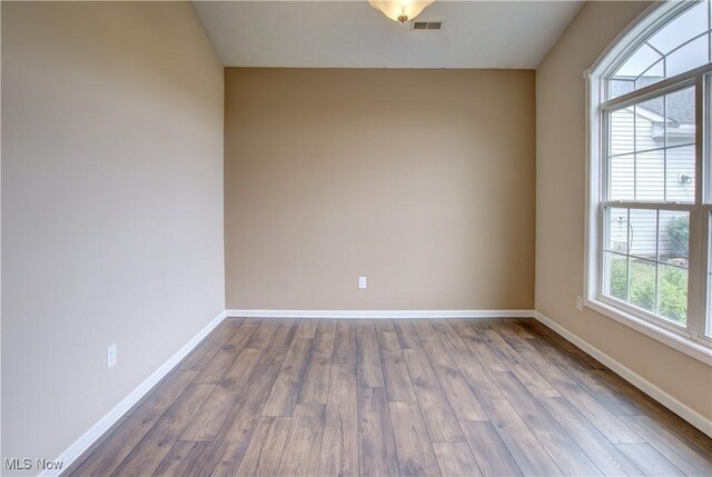 9111 Devonshire Dr, Olmsted Falls, OH 44138 - empty room with baseboards and dark wood-style flooring