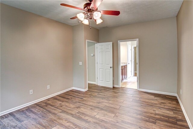9111 Devonshire Dr, Olmsted Falls, OH 44138 - empty room with ceiling fan and wood finished floors