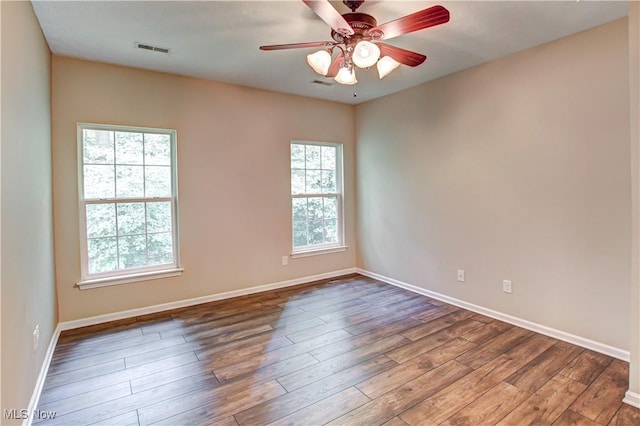9111 Devonshire Dr, Olmsted Falls, OH 44138 - spare room featuring wood finished floors and a ceiling fan