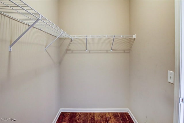 9111 Devonshire Dr, Olmsted Falls, OH 44138 - walk in closet featuring wood finished floors