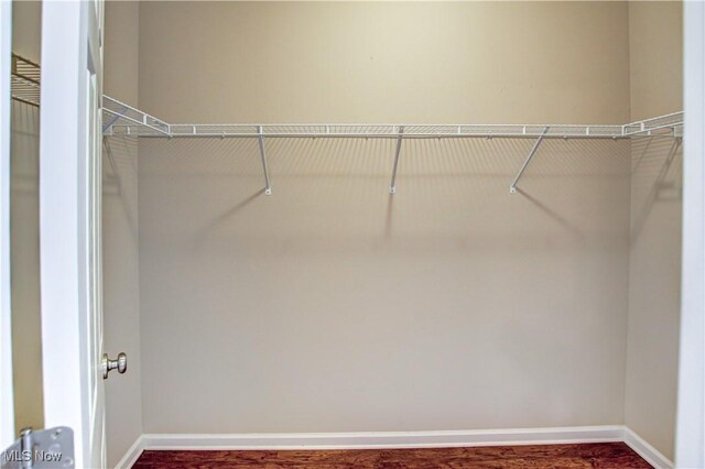 9111 Devonshire Dr, Olmsted Falls, OH 44138 - walk in closet with wood finished floors