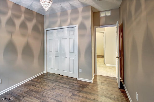 9111 Devonshire Dr, Olmsted Falls, OH 44138 - unfurnished bedroom featuring dark wood-type flooring and a closet