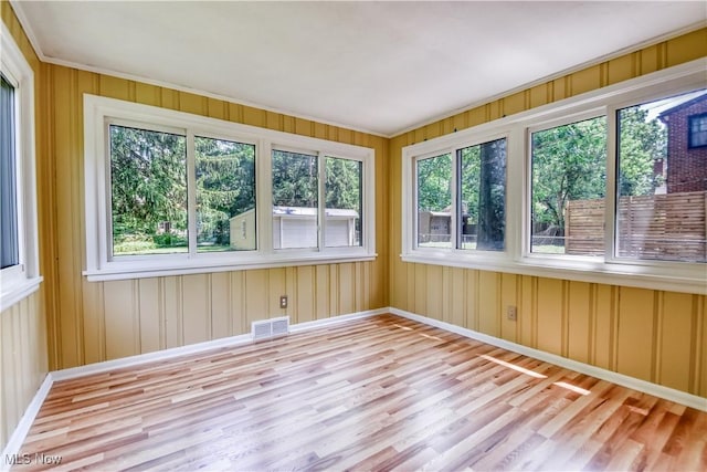 2607 Ashurst Rd, University Heights, OH 44118 - unfurnished sunroom with wood finished floors and a wooden deck