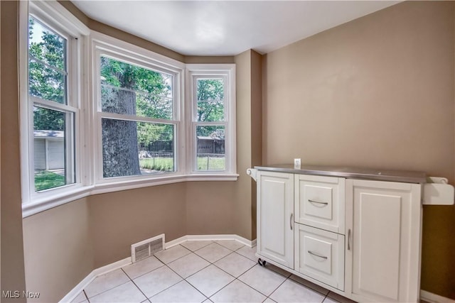 2607 Ashurst Rd, University Heights, OH 44118 - interior space with light tile patterned floors and baseboards