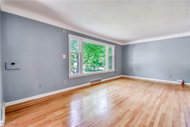 2607 Ashurst Rd, University Heights, OH 44118 - empty room with wood finished floors and baseboards