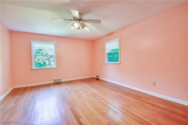 2607 Ashurst Rd, University Heights, OH 44118 - unfurnished room featuring plenty of natural light, light wood finished floors, and ceiling fan