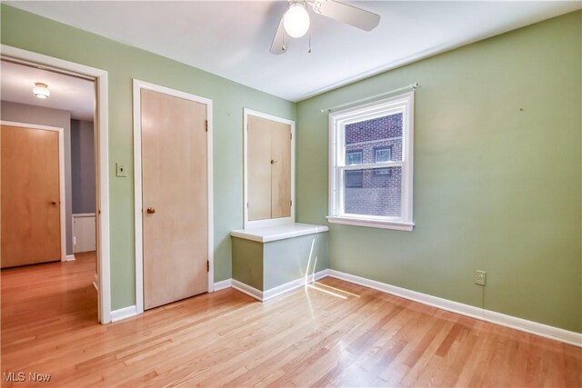 2607 Ashurst Rd, University Heights, OH 44118 - unfurnished room featuring light wood-type flooring and ceiling fan